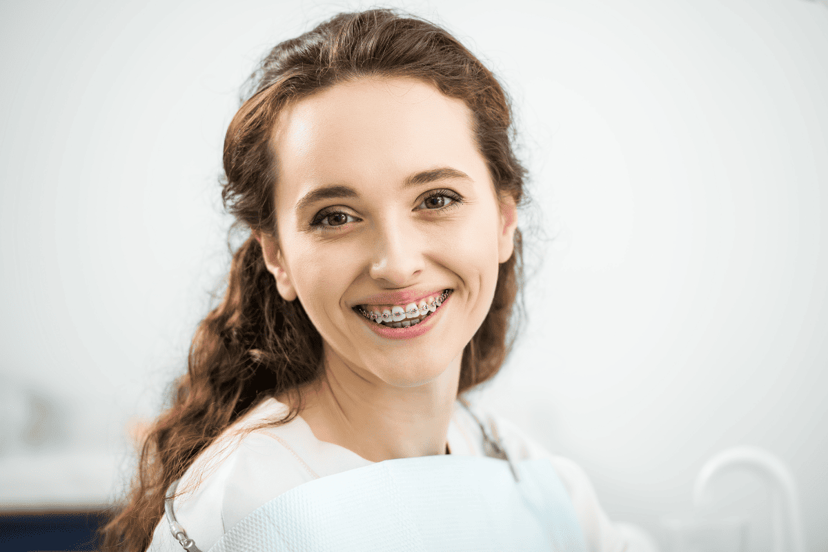 Young woman with braces smiling