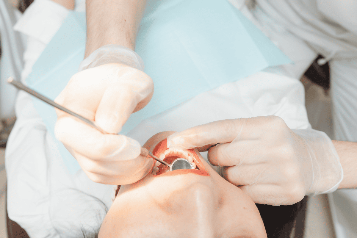 Dentist performing a dental procedure on a patient
