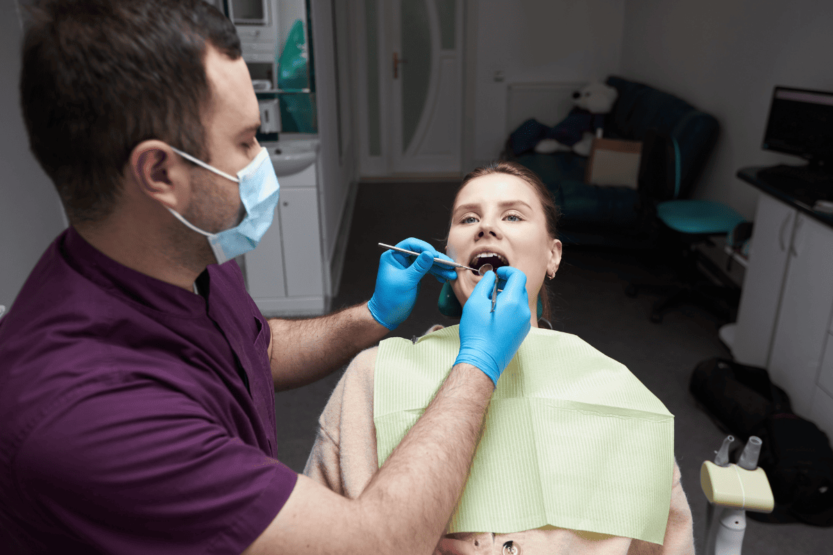 Dentist checking a patient's tooth